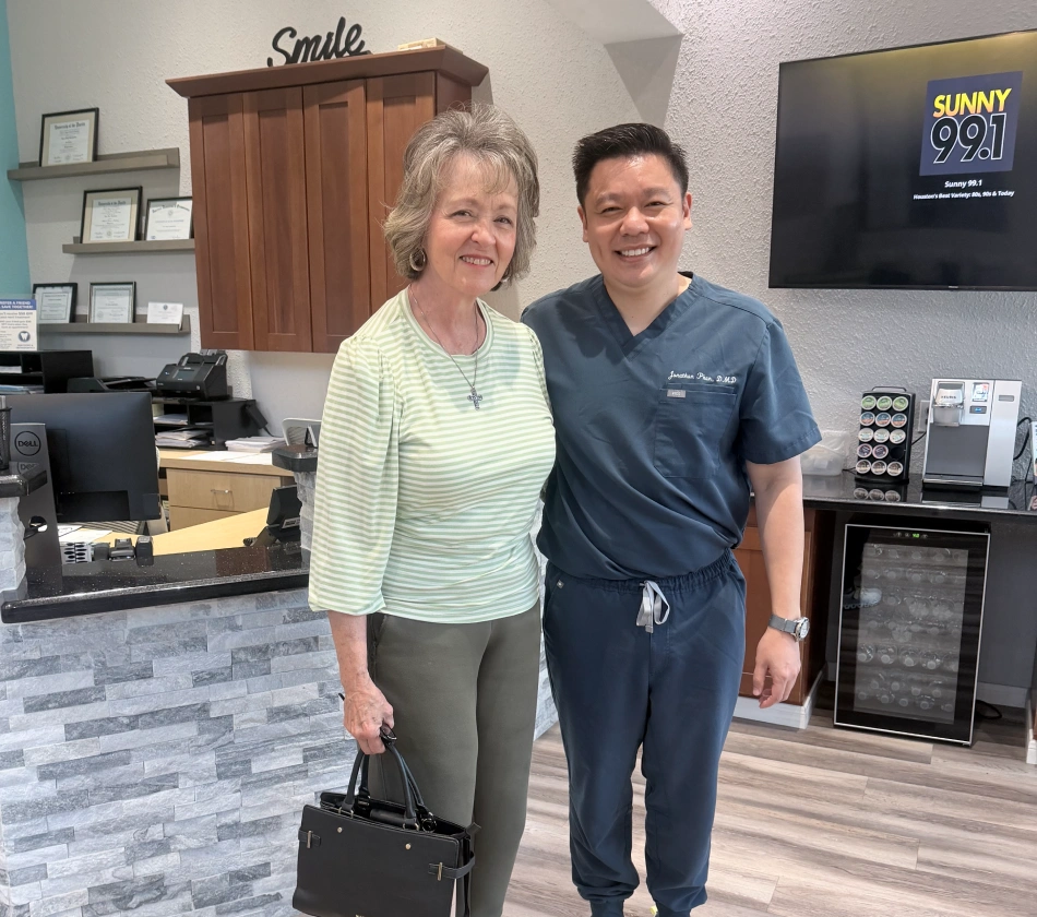 Dr Jonathan Phan with patient standing on reception room